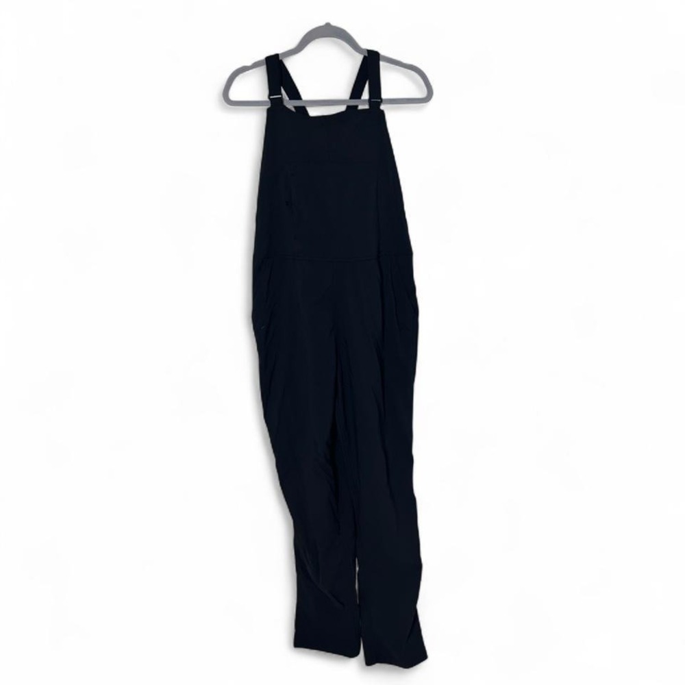 Flylow black nylon Overalls  with pockets and adjustable straps. Size: L